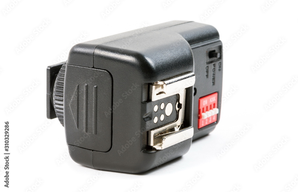 Black studio flash transmitter on the white Black studio flash transmitter on the white