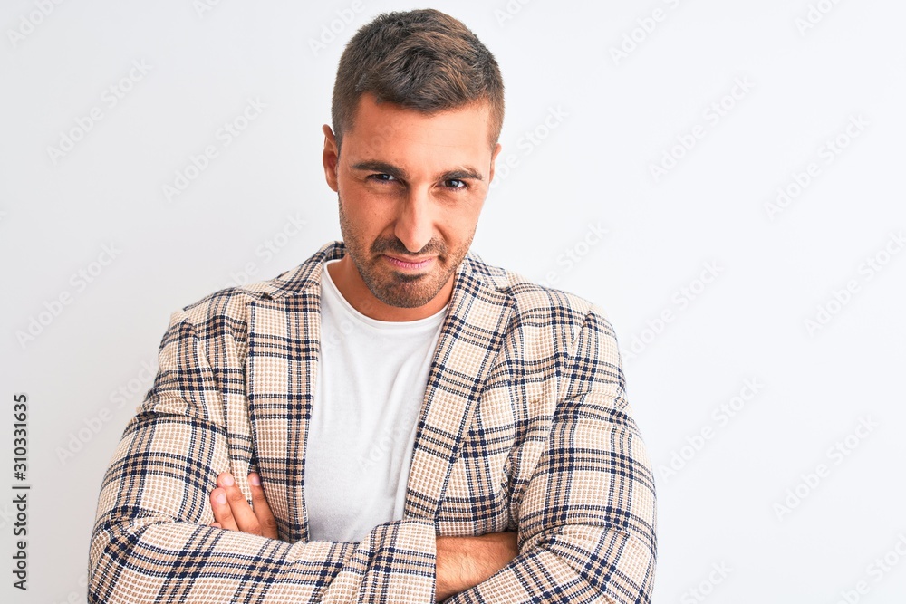 Young handsome business man wearing elegant jacket over isolated background skeptic and nervous, disapproving expression on face with crossed arms. Negative person. Young handsome business man wearing elegant jacket over isolated background skeptic and nervous, disapproving expression on face with crossed arms. Negative person.