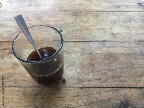 cup of coffee on wooden table