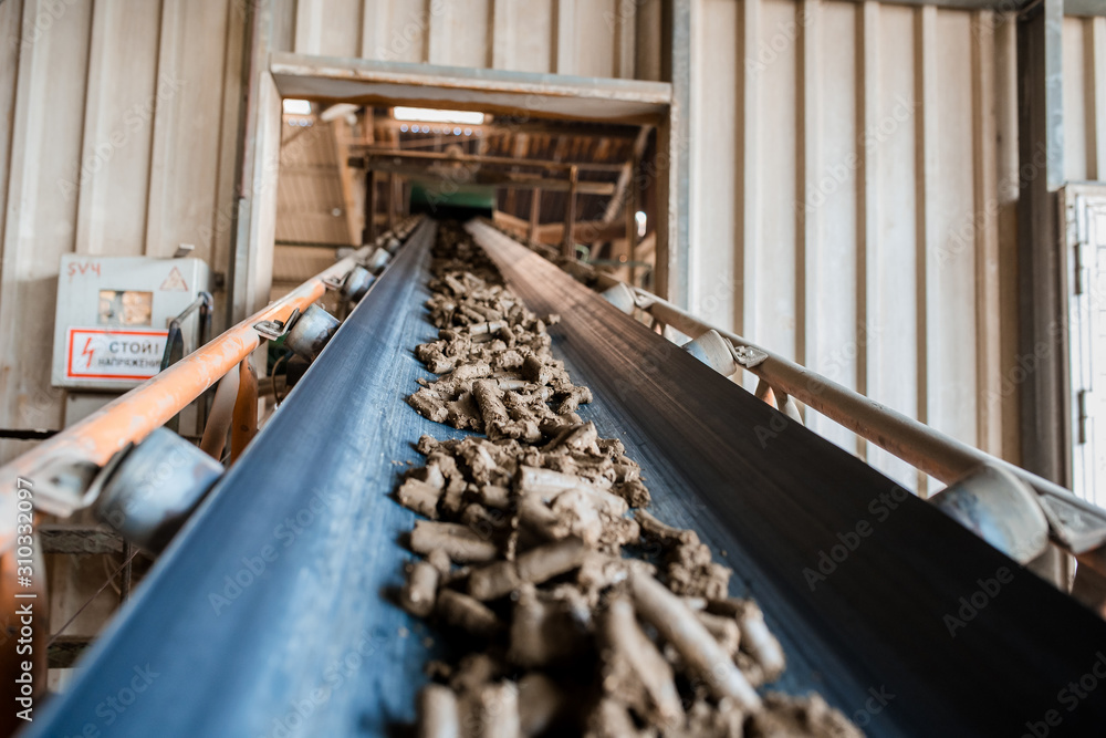 Clay for bricks. Plant for production building material with ready brick, construction industrial. Production of bricks on plant. Workflow, close-up. Clay for bricks. Plant for production building material with ready brick, construction industrial. Production of bricks on plant. Workflow, close-up.