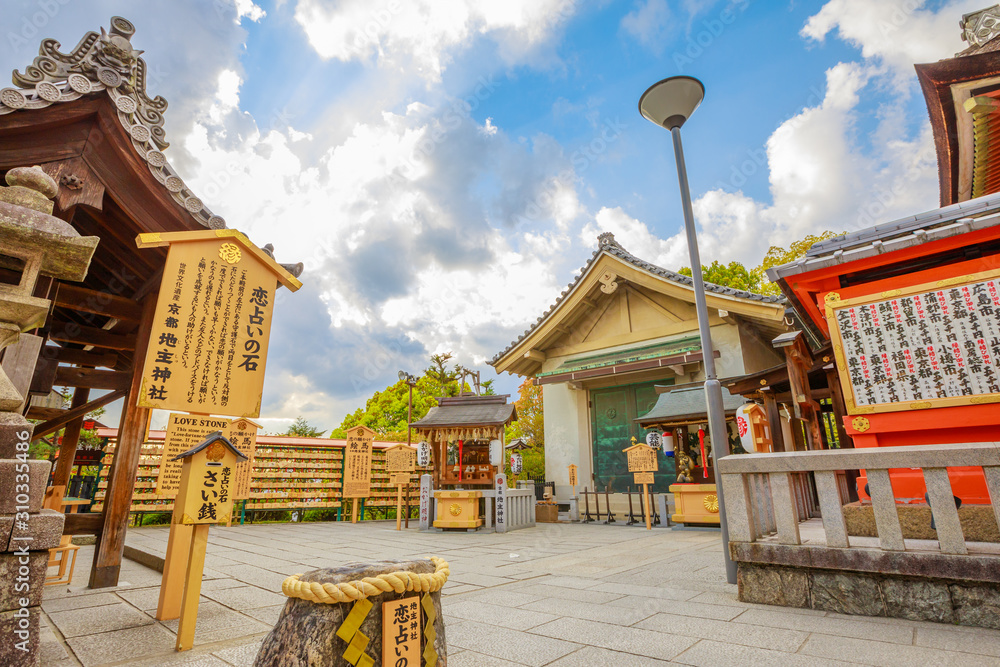 Kyoto, Japan April 24, 2017 Love Stone of Jishu Jinja Shrine, behind