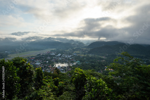 Beautiful landscape of city and nature in the morning fog - Mae Hong Son aerial view from Wat Phra That Doi Kong Mu Temple, nothern Thailand