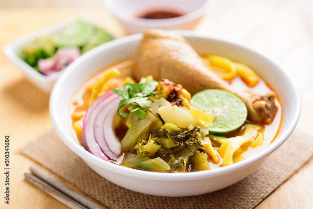 Northern Thai food (Khao Soi Kai), spicy egg noodles soup with chicken