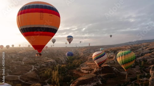 A balloon flies over Cappadocia, shooting from a drone in 4K photo