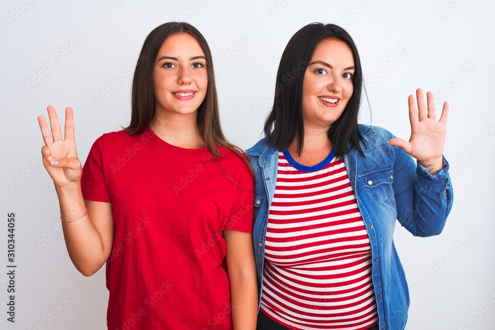 Young beautiful women wearing casual clothes standing over isolated white background showing and pointing up with fingers number eight while smiling confident and happy. Young beautiful women wearing casual clothes standing over isolated white background showing and pointing up with fingers number eight while smiling confident and happy.