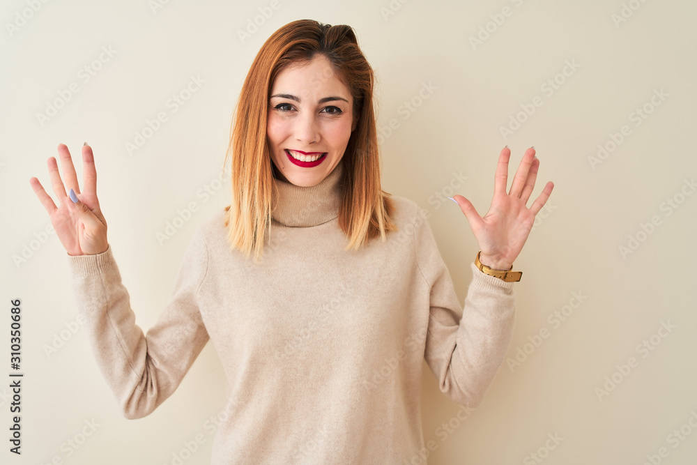 Redhead woman wearing elegant turtleneck sweater standing over isolated white background showing and pointing up with fingers number nine while smiling confident and happy. Redhead woman wearing elegant turtleneck sweater standing over isolated white background showing and pointing up with fingers number nine while smiling confident and happy.