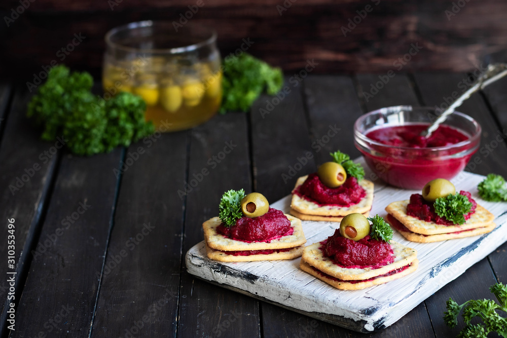 Beetroot relish on crackers. An original party snack.