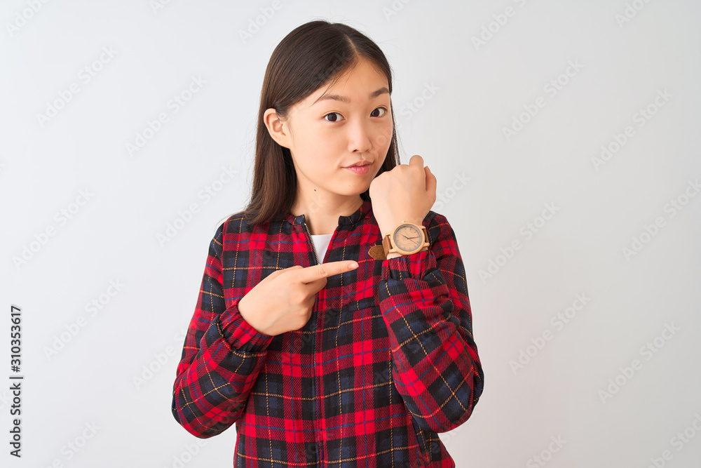 Young chinese woman wearing casual jacket standing over isolated white background In hurry pointing to watch time, impatience, looking at the camera with relaxed expression Young chinese woman wearing casual jacket standing over isolated white background In hurry pointing to watch time, impatience, looking at the camera with relaxed expression