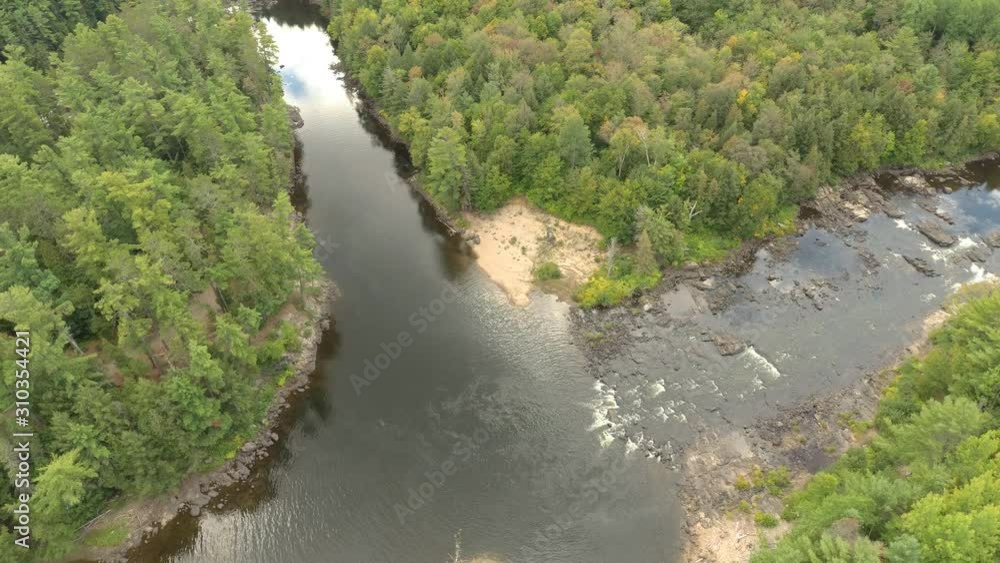 Very slow moving aerial shot of river junction with a few cascades Very slow moving aerial shot of river junction with a few cascades