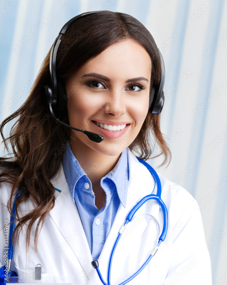 Portrait of happy smiling young doctor in headset, at office. Healthcare, medicine and medical staff concept. Portrait of happy smiling young doctor in headset, at office. Healthcare, medicine and medical staff concept.
