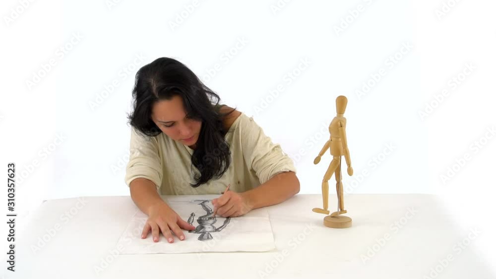 Girl Drawing Wooden Mannequin Art Figurine in White Background Studio
