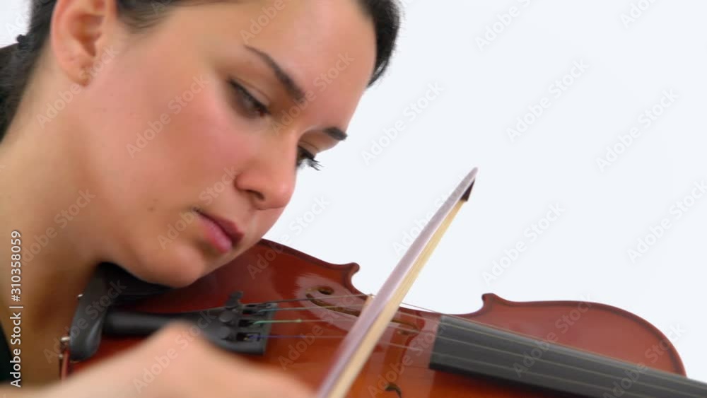 Violinist Woman Playing Fiddle Violin Instrument in Studio, Close Up Violinist Woman Playing Fiddle Violin Instrument in Studio, Close Up