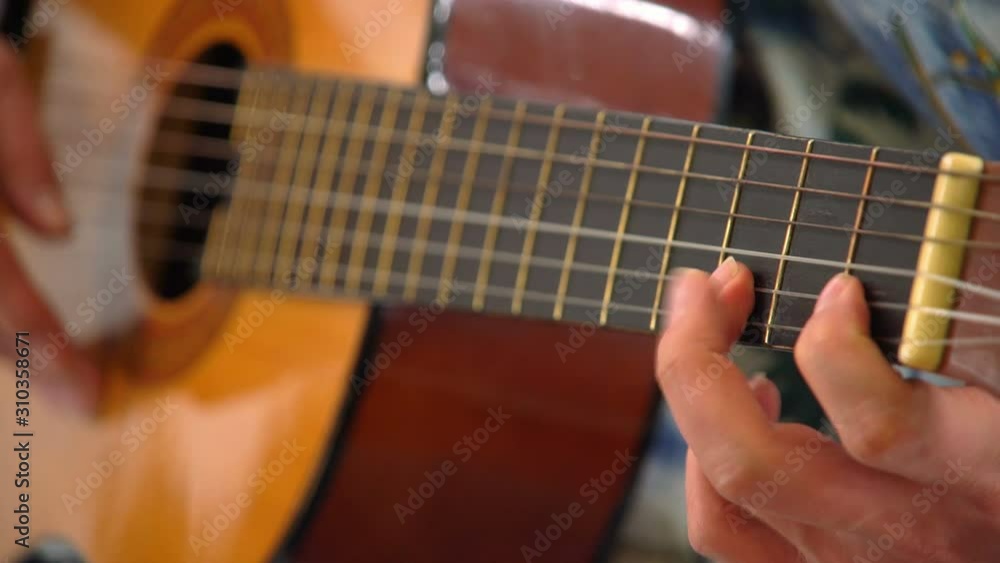 Man's Hands Playing Classical Guitar, Close Up Man's Hands Playing Classical Guitar, Close Up