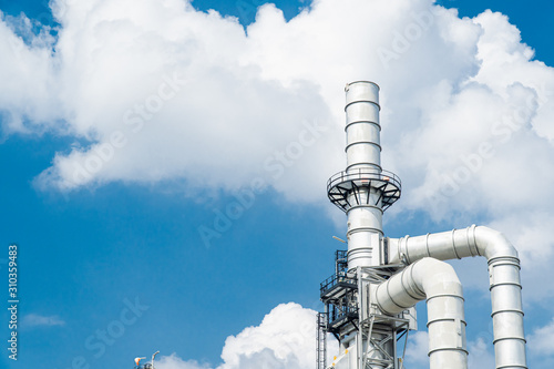 Oil and gas industrial,Oil refinery plant form industry,Refinery factory oil storage tank and pipeline steel blue sky background