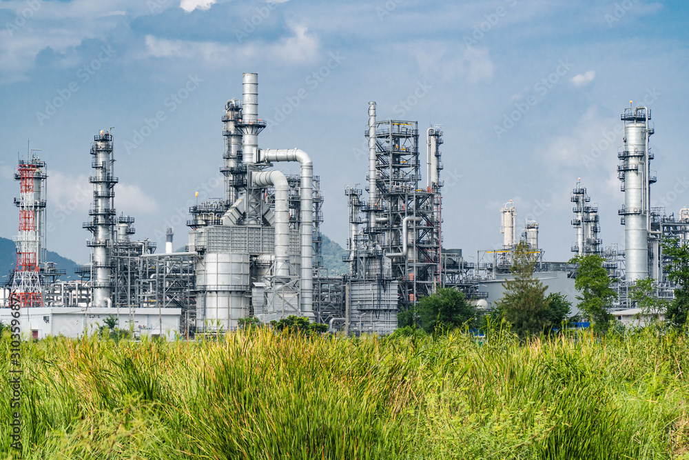Oil and gas industrial,Oil refinery plant form industry,Refinery factory oil storage tank and pipeline steel blue sky background Oil and gas industrial,Oil refinery plant form industry,Refinery factory oil storage tank and pipeline steel blue sky background