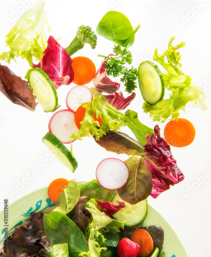 Flying tossed salad and vegetables 