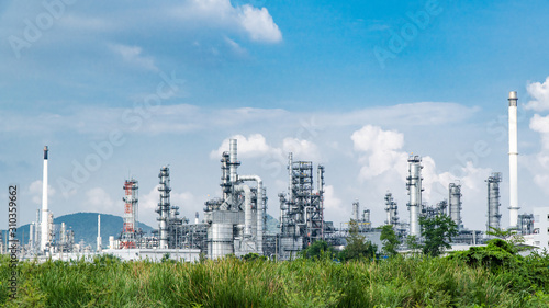 Oil and gas industrial,Oil refinery plant form industry,Refinery factory oil storage tank and pipeline steel blue sky background photo