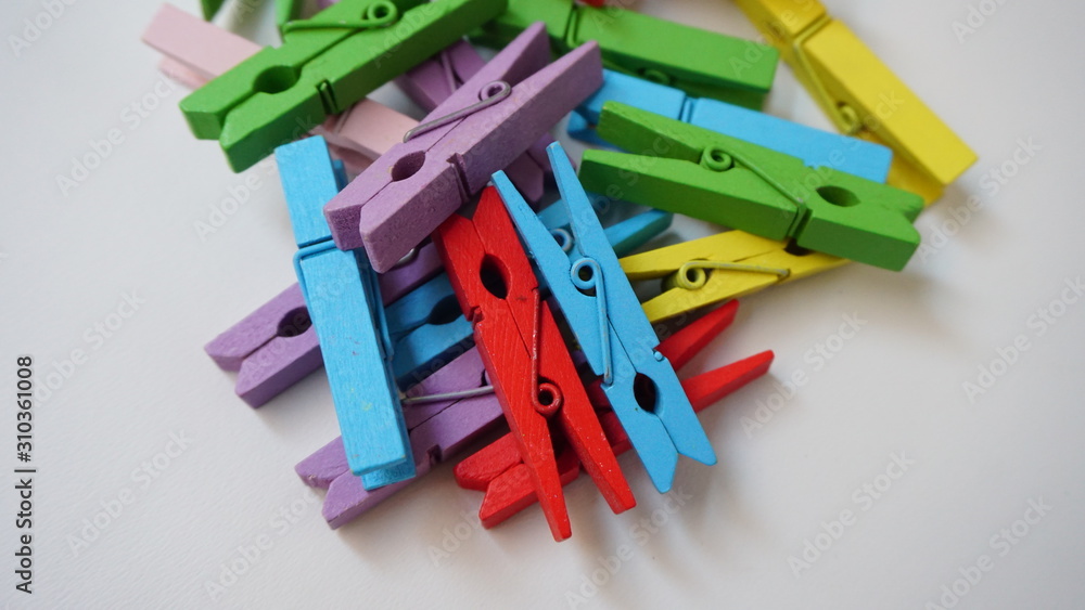 Fototapeta premium colorful shirt clips on a white background