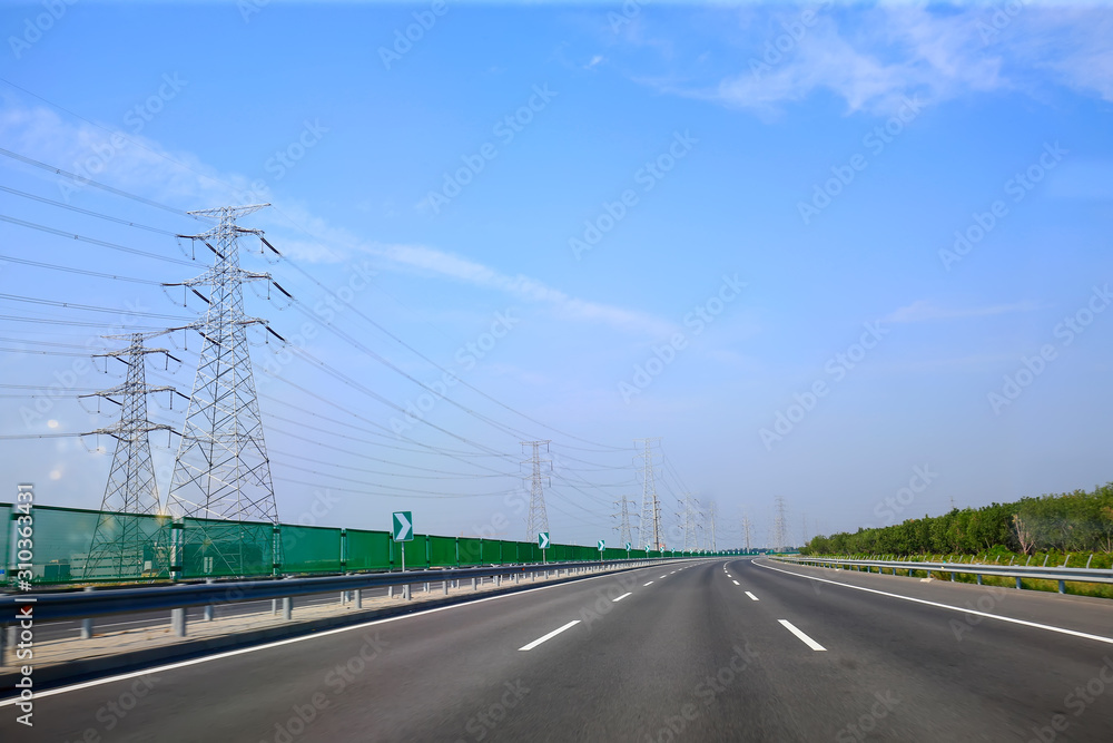 Beautiful highway, under the blue sky and white clouds