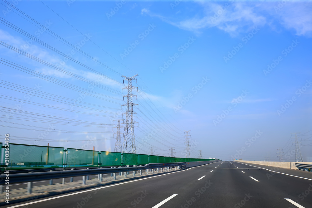 Beautiful highway, under the blue sky and white clouds