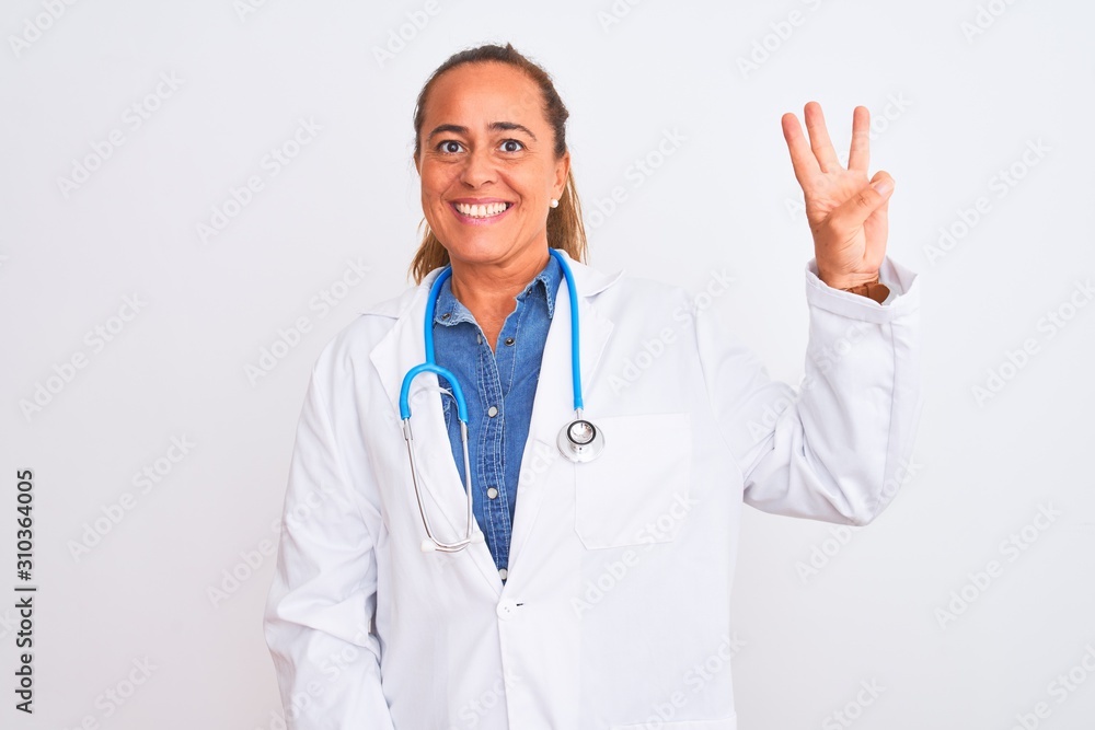 Middle age mature doctor woman wearing stethoscope over isolated background showing and pointing up with fingers number three while smiling confident and happy. Middle age mature doctor woman wearing stethoscope over isolated background showing and pointing up with fingers number three while smiling confident and happy.
