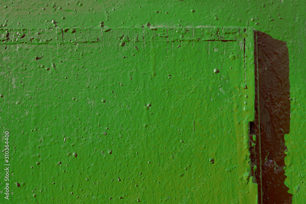 Old painted green door texture close-up. Abstract background Old painted green door texture close-up. Abstract background