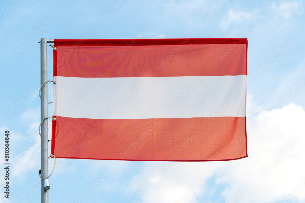 the national flag of Austria on the background of blue sky, the flag of the Austrian state on a blue background the national flag of Austria on the background of blue sky, the flag of the Austrian state on a blue background