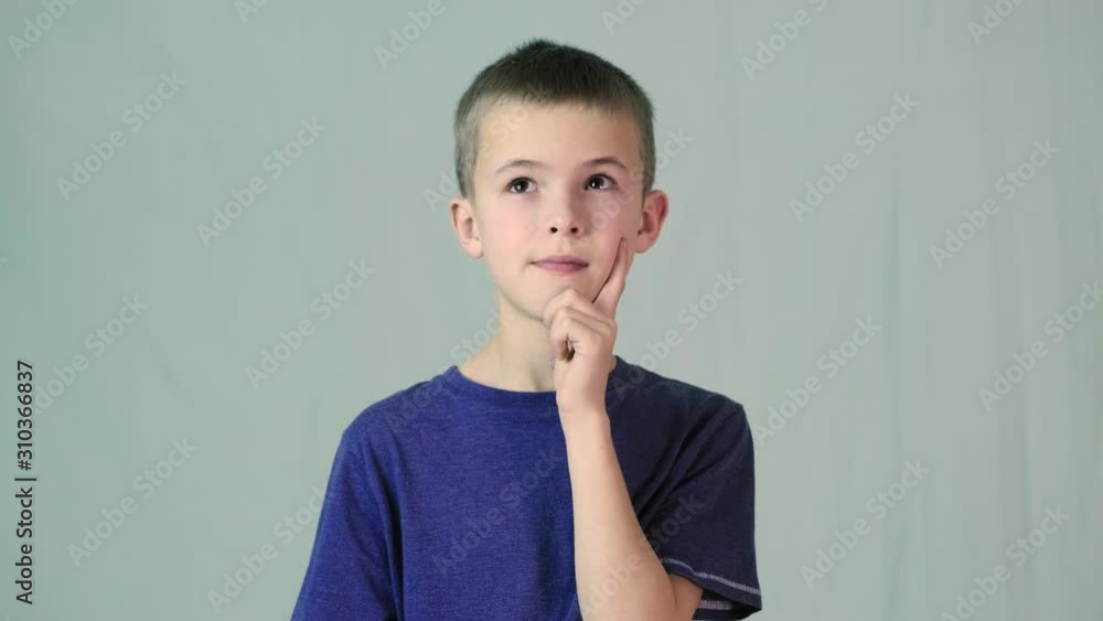 Portrait of child boy shrugging his shoulders making innocent I don't know expression. Portrait of child boy shrugging his shoulders making innocent I don't know expression.