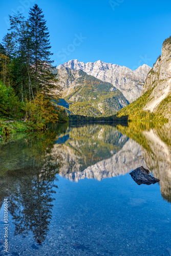 The beautiful Obersee in the Bavarian Alps with a reflection of the mountains in the water photo