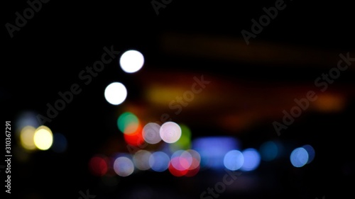 Dark abstract Colorful city Blur background with circular bokeh. space for text. with selective focus © Pachara