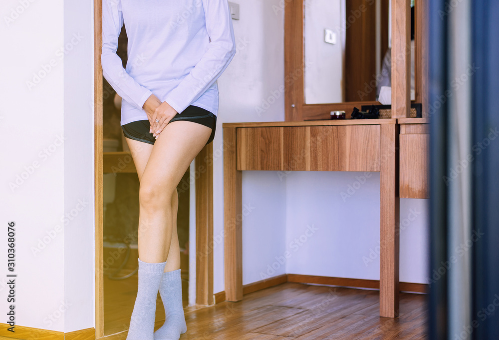 Woman hands holding her crotch,Female need to pee,Urge incontinence