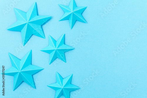 Abstract background with colorful paper origami stars. Holiday, celebration, birthday, greeting card, invitation, diy concept