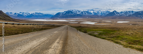 Dalton Highway with Frozen Lake Galbraith and Alaska Range