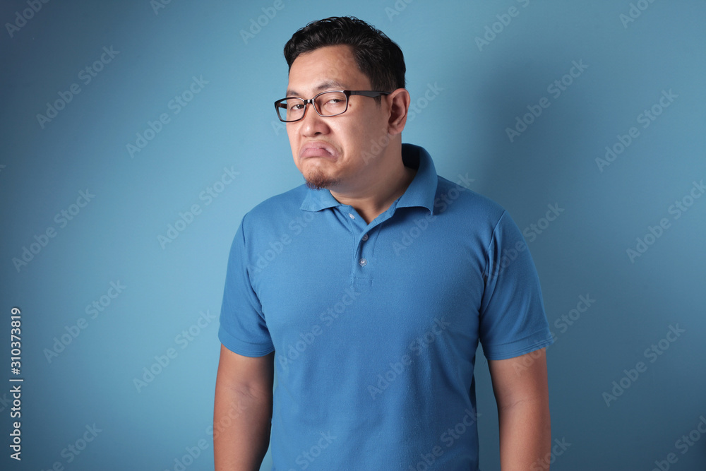 Fototapeta premium Young Man Shows Upset Cynically Annoyed Gesture