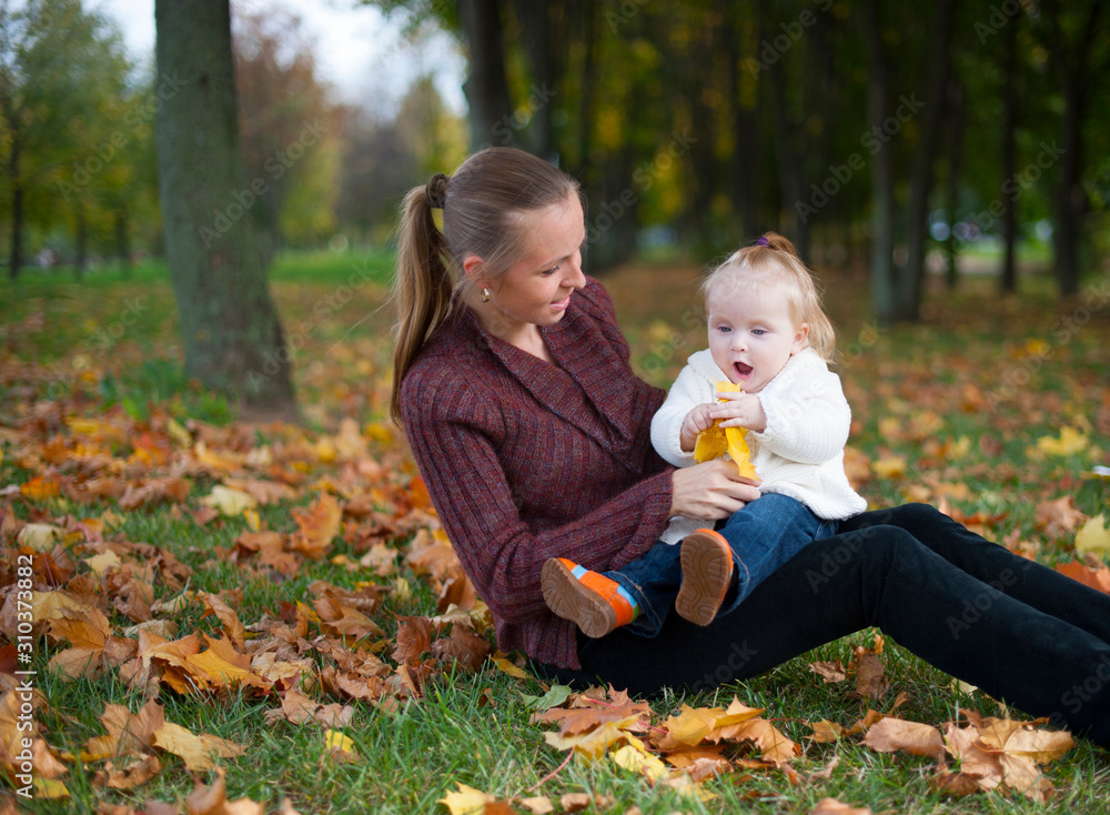 mother with child in the autumn forest for a walk mother with child in the autumn forest for a walk