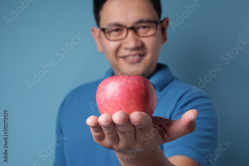 Funny Man Eating Red Apple