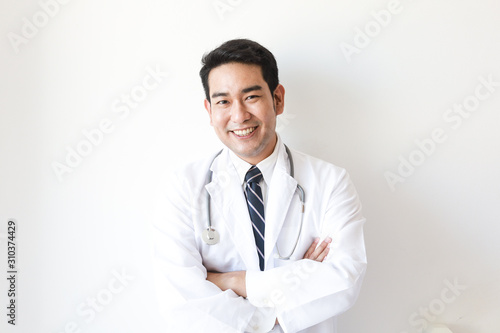 Asian man in Doctor uniform on white background in hospital © chayathon2000