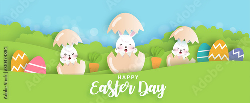 Easter banner with cute bunny rabbits in paper cut style. © Nattapohn