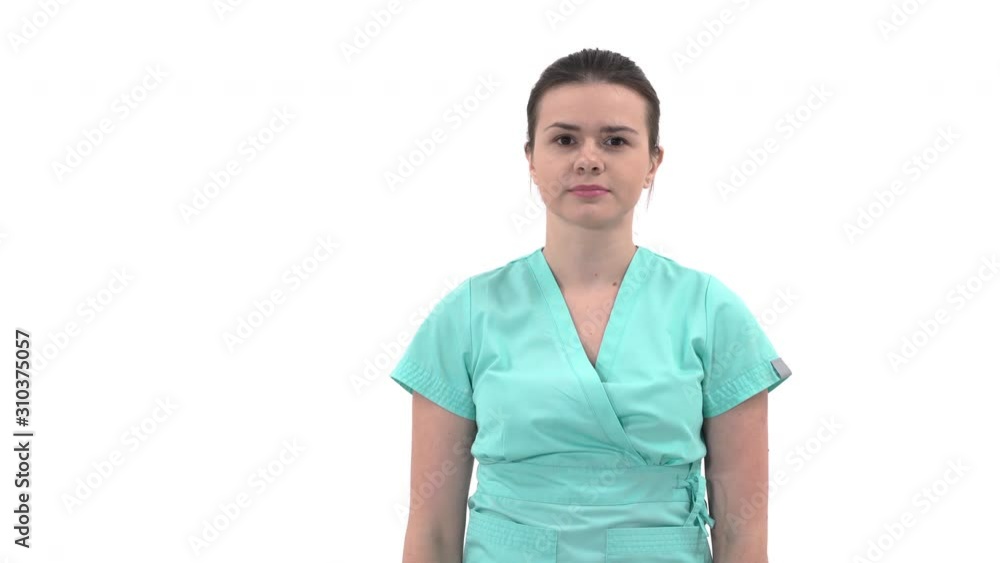 Close-up portrait of a young cheerful female therapist taking off phonendoscope or stethoscope. Medical concept. Isolated, on white background Close-up portrait of a young cheerful female therapist taking off phonendoscope or stethoscope. Medical concept. Isolated, on white background
