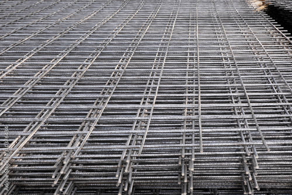 Rebar, reinforcing bars or steel close up, reinforcement steel, wires mesh of steel used as a tension device in reinforced concrete. Rebar, reinforcing bars or steel close up, reinforcement steel, wires mesh of steel used as a tension device in reinforced concrete.