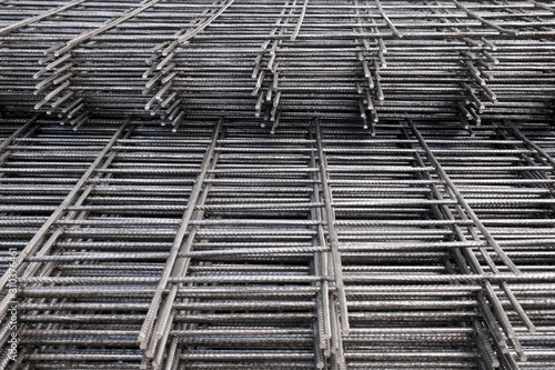 Fotografie Rebar, reinforcing bars or steel close up, reinforcement steel, wires mesh of steel used as a tension device in reinforced concrete