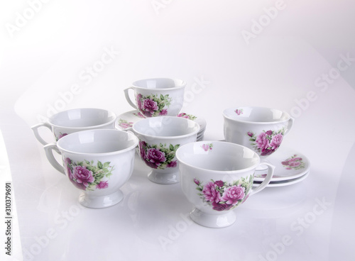cup or hand painted flower ceramic mug set on the background new.
