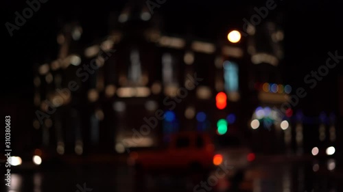 Blurred bokeh traffic on the road at night in a big city.