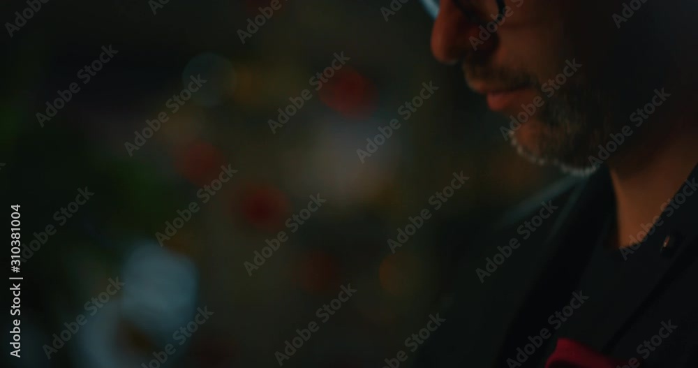 Close up of a professional bartender is mixing an alcoholic cocktail with professional crystal long lasting ice cubes to customers at the bar or disco club. Close up of a professional bartender is mixing an alcoholic cocktail with professional crystal long lasting ice cubes to customers at the bar or disco club.