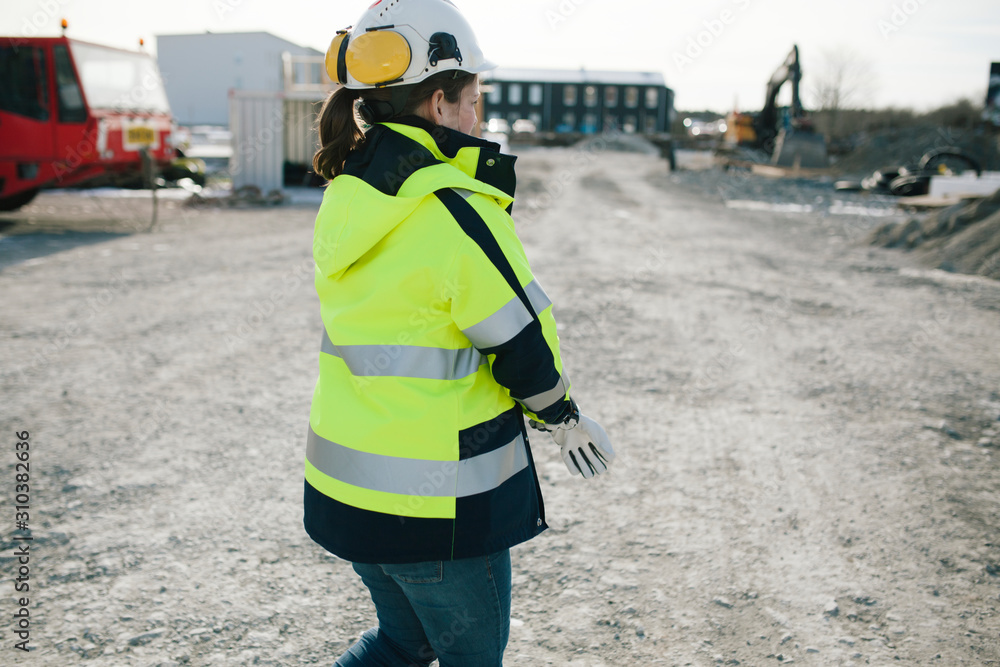 Female construction worker on building site Female construction worker on building site