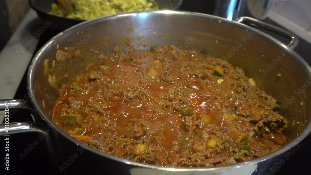 Stockholm, Sweden Bolognese sauce with meat puttering on the stove. Stockholm, Sweden Bolognese sauce with meat puttering on the stove.