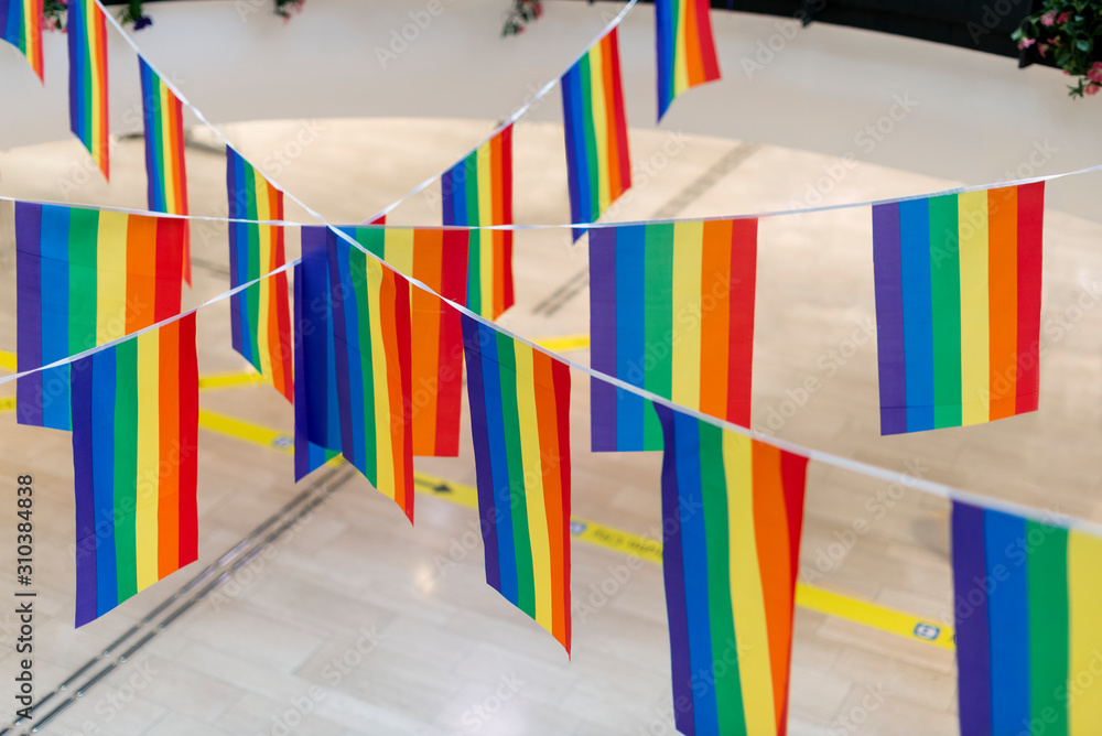 Rainbow flags hanging on rope