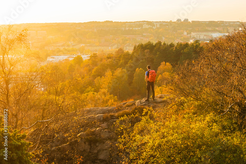 Wallpaper Mural Man looking at sunset Torontodigital.ca
