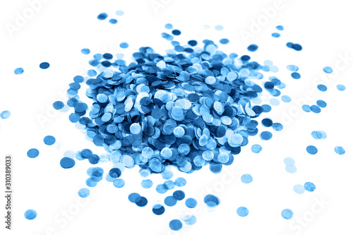 Heap of festive round paper blue confetti isolated on white. Festive concept.