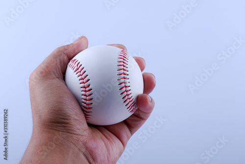 Photography Hand hold A professional baseball isolated on white.